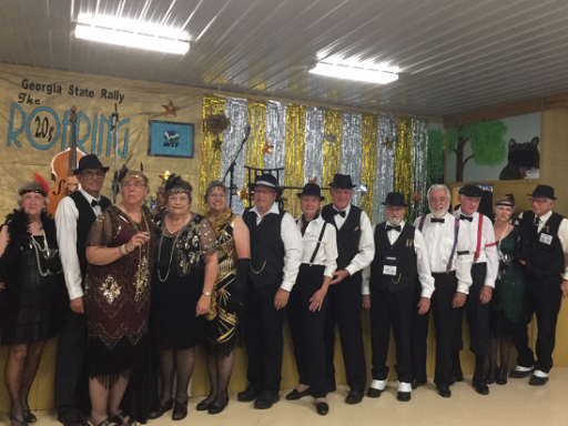 Group of people dressed in 1920's attire.